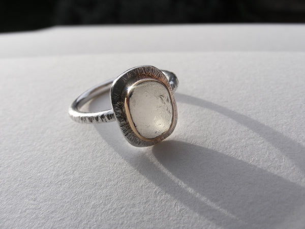 Clear sea foam sea glass ring bezel set in recycled 9ct gold