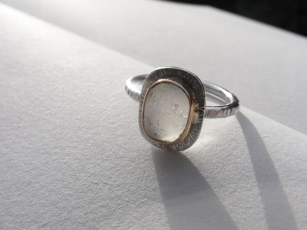 Clear sea foam sea glass ring bezel set in recycled 9ct gold