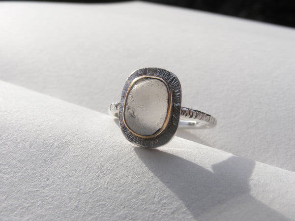 Clear sea foam sea glass ring bezel set in recycled 9ct gold