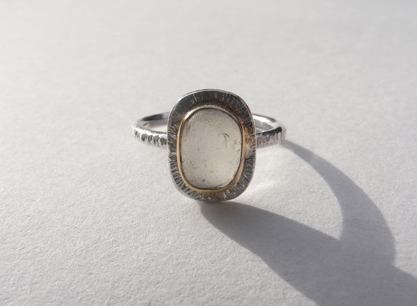 Clear sea foam sea glass ring bezel set in recycled 9ct gold