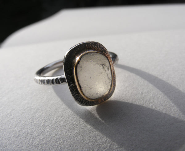 Clear sea foam sea glass ring bezel set in recycled 9ct gold
