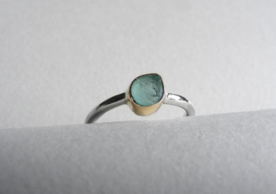 Sea foam sea glass ring bezel set in 9ct gold with silver band