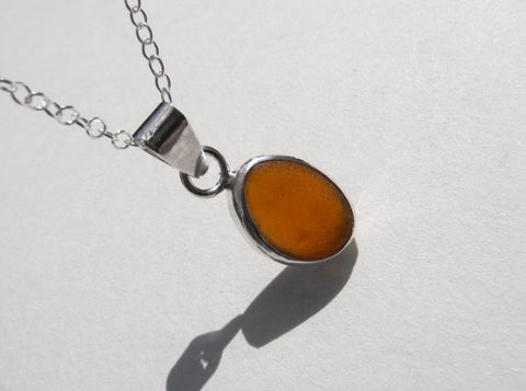 Amber brown sea glass pendant with 18" silver fine trace chain