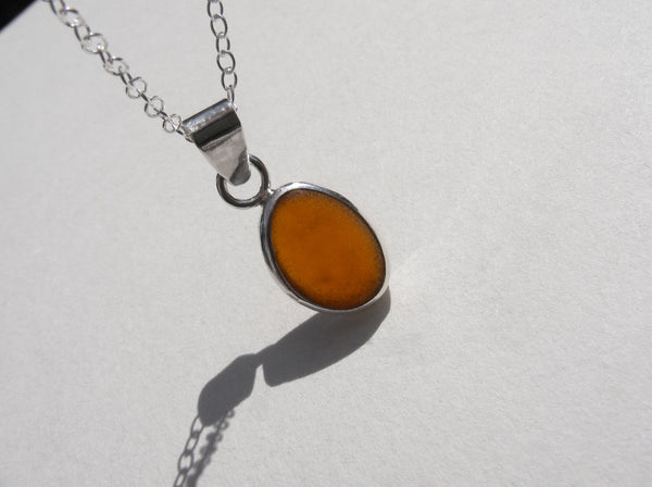 Amber brown sea glass pendant with 18" silver fine trace chain