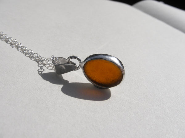 Amber brown sea glass pendant with 18" silver fine trace chain