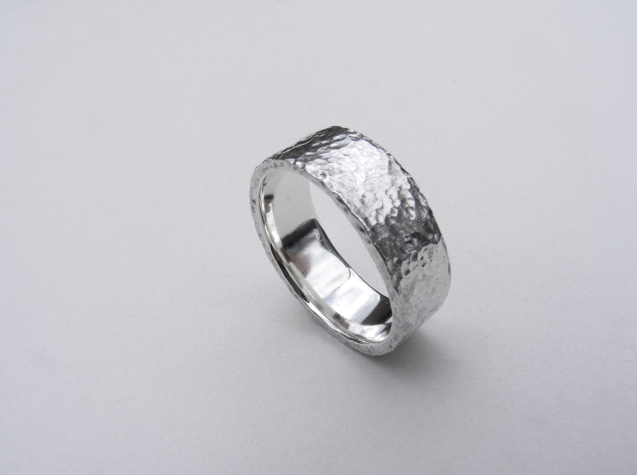 Heavy, hammered, molten ring in recycled silver Size P.5