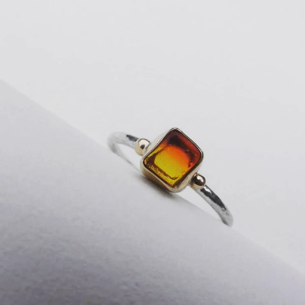 Sunrise sea glass ring. Bezel set in recycled 9ct gold with silver shank. Size O