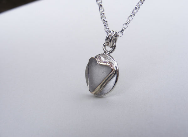 Sea Foam sea glass heart pendant in silver and gold accents
