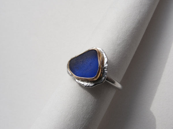 Bristol blue seaglass silver ring with gold nugget details and bezel set in gold. M.5
