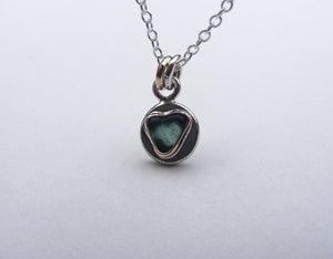 Teal sea glass heart pendant in silver and gold accents with Fine Trace Chain