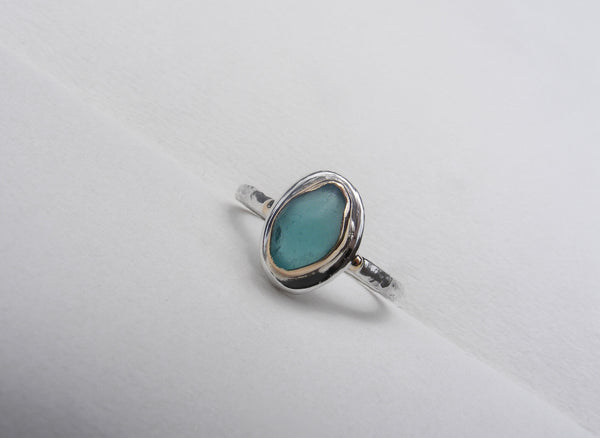 Teal sea glass 9ct gold with a silver hammered band