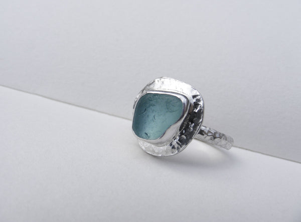 Sea Foam sea glass ring set on a heavily hammered recycled silver band